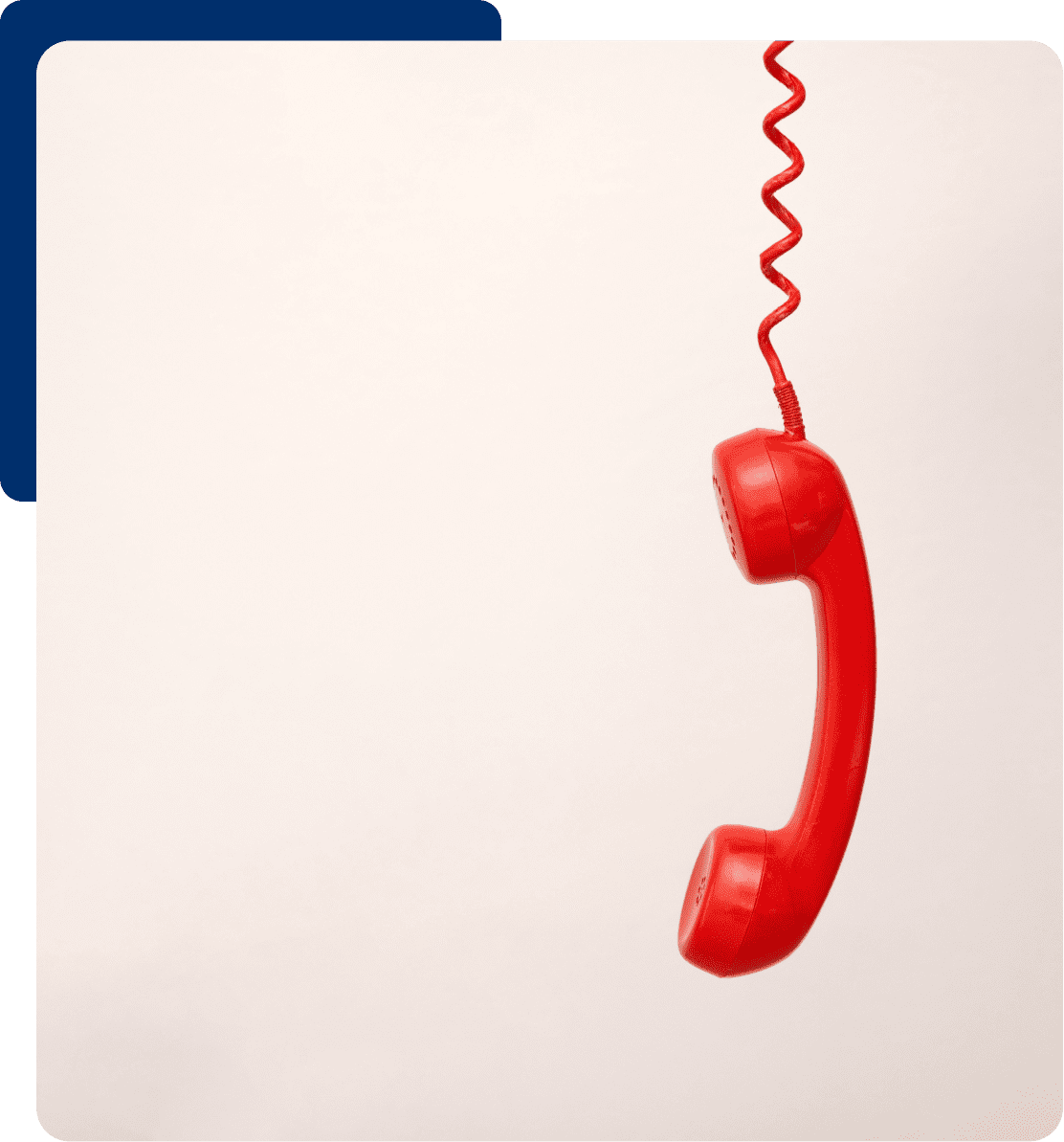 Red telephone receiver with curly cord hanging.